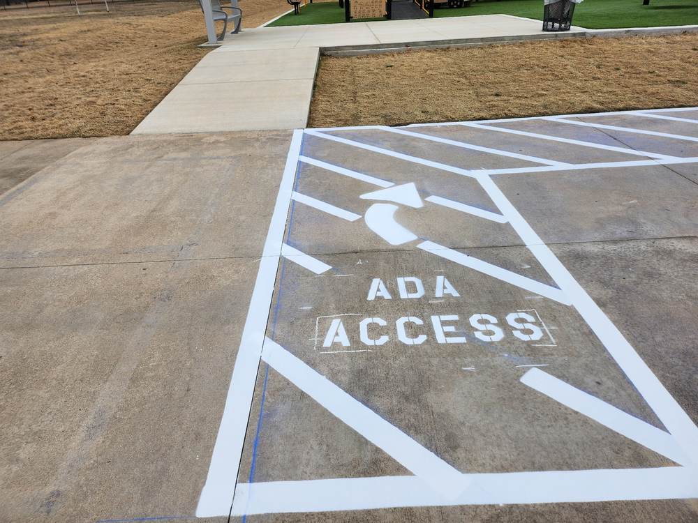 ADA access stencil detail on pavement