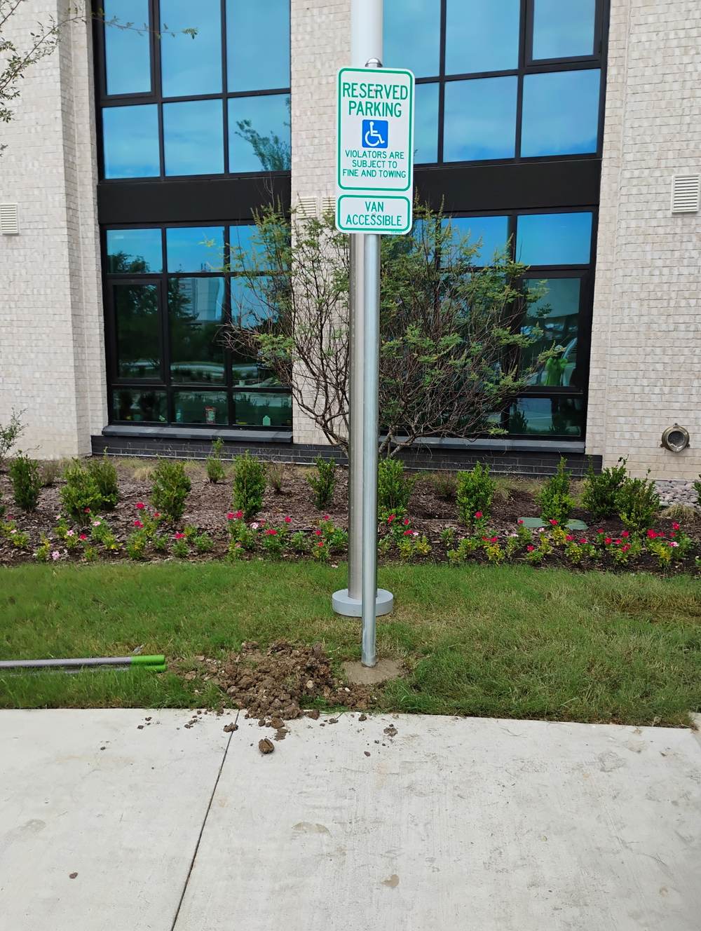 Reserved parking van accessible signage at office building
