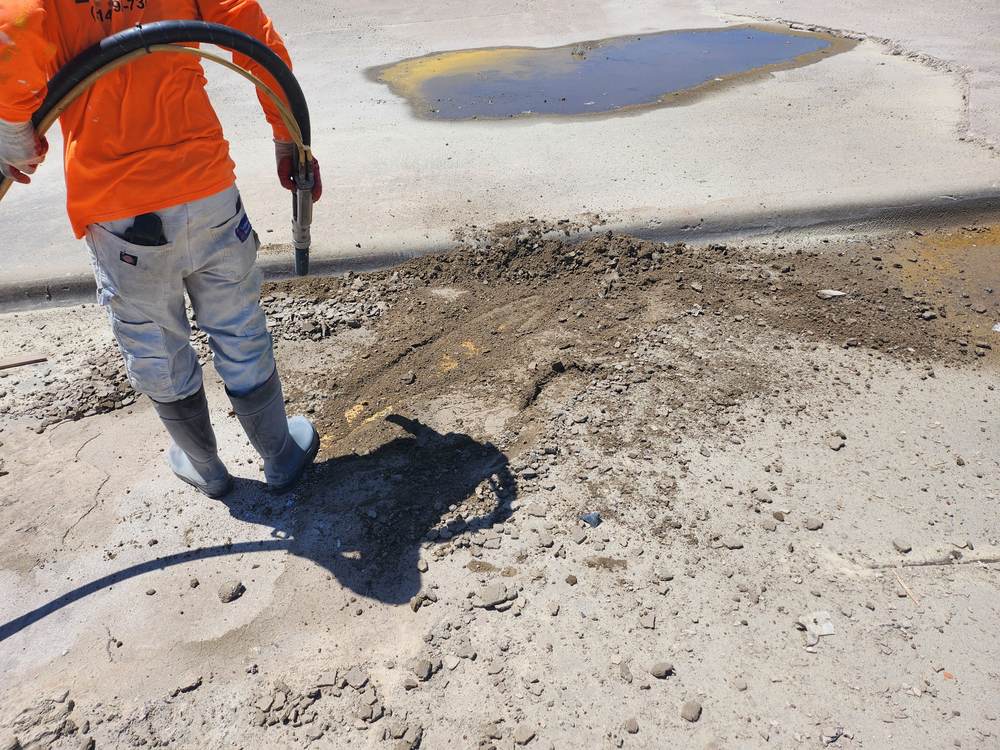 Sandblasting surface preparation detail on concrete
