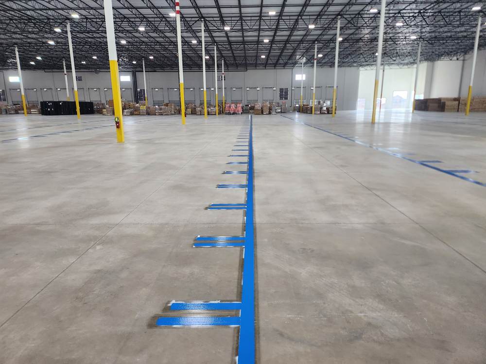 Warehouse floor striping, blue rack-protection lines